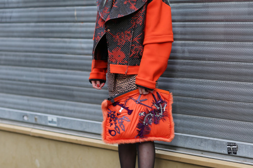 Bold textures and patterns are pulled together by a chromatic orange outside #PFW #streetstyle 