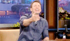 Chris Evans laughing and grabbing chest
