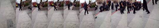 kaiiwooo:  nigerianoreo:  hellajerica:  mooseblogtimes:  A police officer in Stockton, CA caught on cell phone video beating a teen bloody with a button for taking one step off the curb into the street.     Why does there have to be like ten cops for