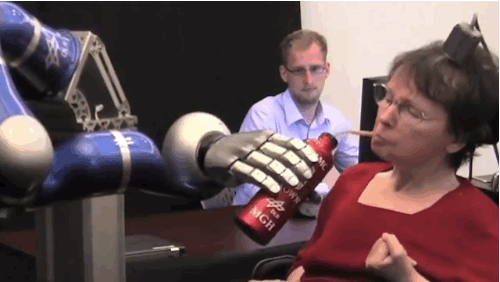  In 2011, Cathy Hutchinson her first sip of coffee on her own in 15 years. She brought the coffee to her lips by controlling a robotic arm with her thoughts.  GIF credits: Brown University