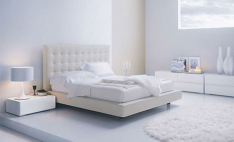Black tufted bed with storage